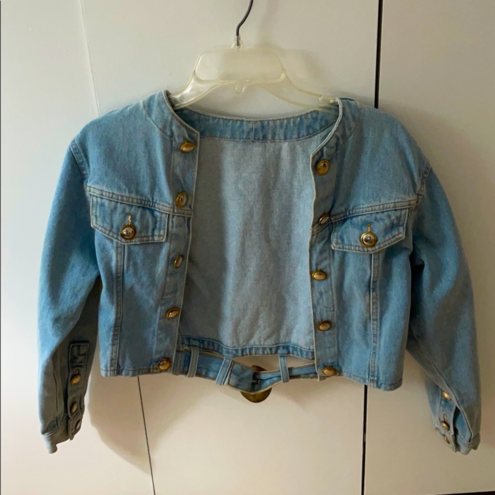 Cropped jean jacket with gold buckles